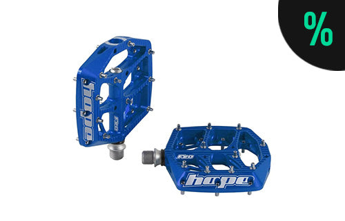 Blaue Hope Fahrradpedale mit Metallstiften, geeignet für Mountainbiking.