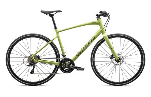 Specialized Fahrrad in Hellgrün, sportliches Design mit geradem Lenker und Scheibenbremsen. Ideal für Stadt und Freizeit.